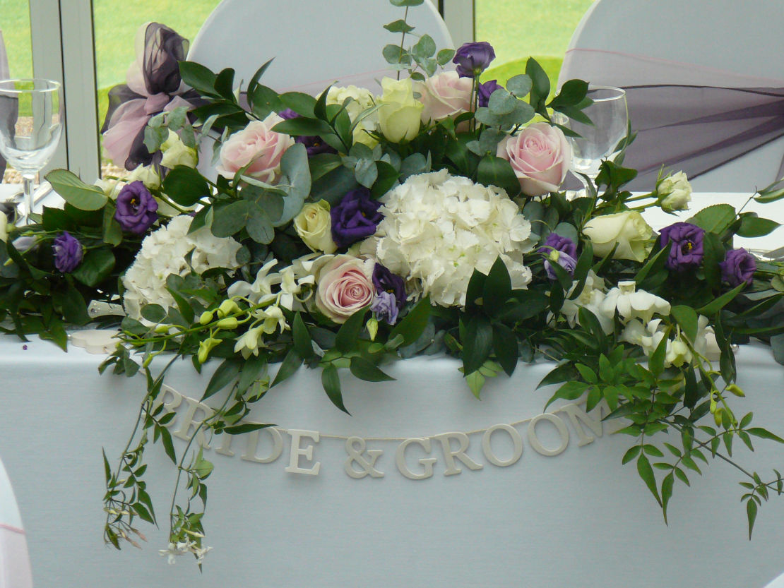 Long Top table and ceremony table arrangement